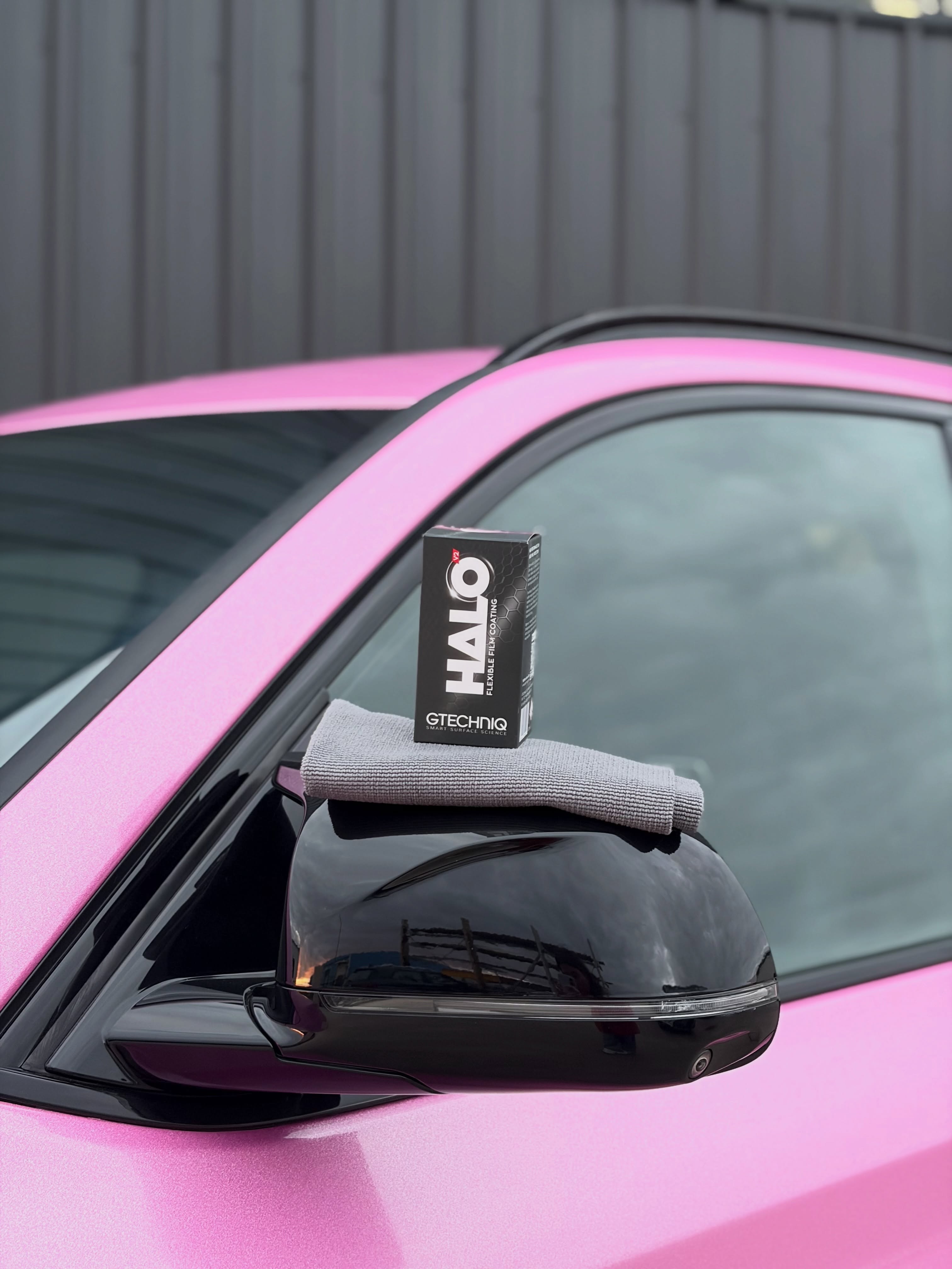 Satin pink colour-change wrap detail on a BMW